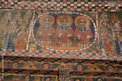 : iconographic scenes and wall murals of saints painted in naive african christian style in Abreha Atsbeha church 
