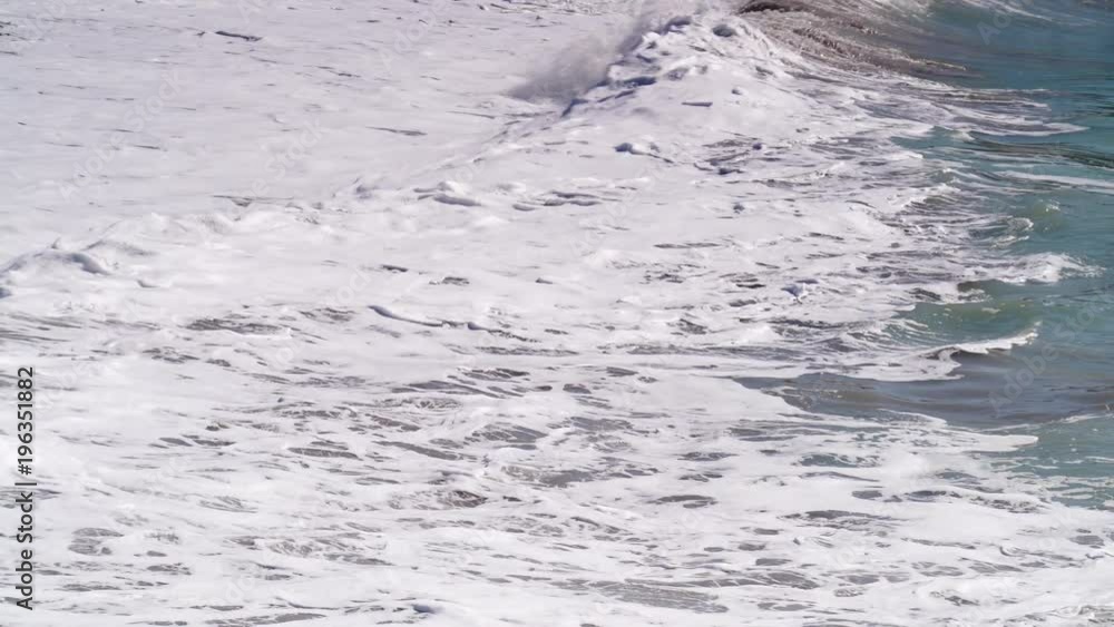 Sea storm blue waves forming white foam on sunny day. Sea storm blue waves forming white foam on sunny day.