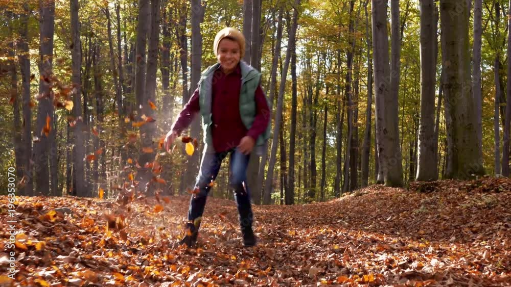 Happy child running in the forest Happy child running in the forest