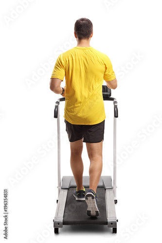 Young man exercising on a treadmill