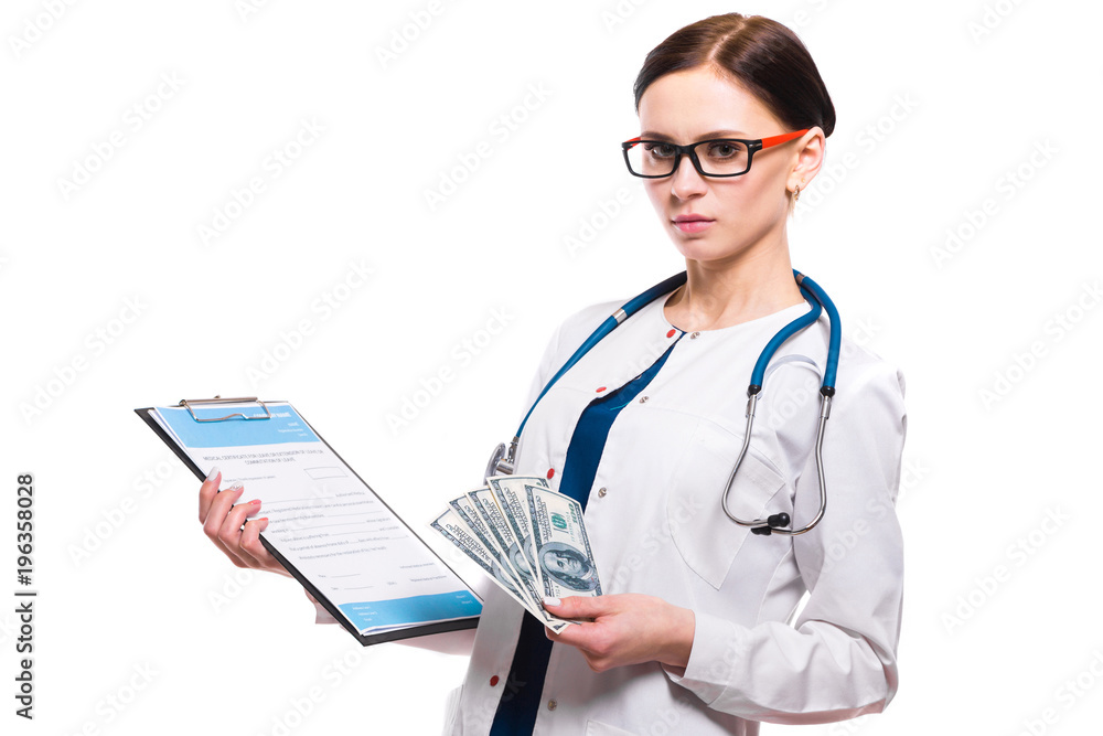 Young beautiful female doctor holding clipboard and money in her hands on white background Young beautiful female doctor holding clipboard and money in her hands on white background
