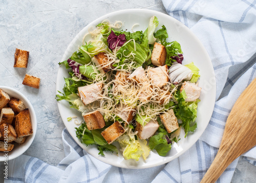 Caesar salad in white plate