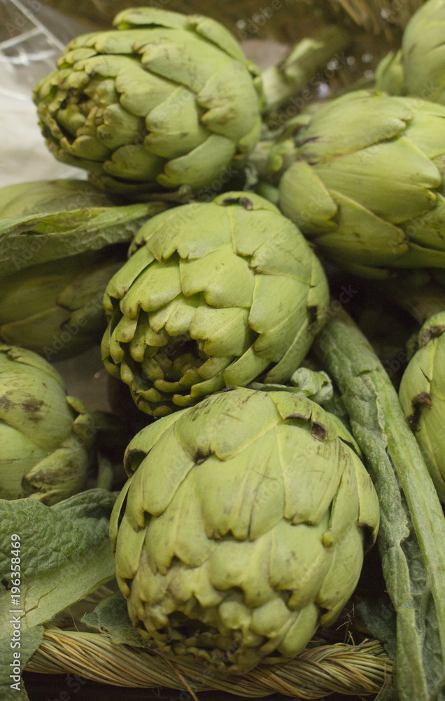 Fototapeta premium fresh artichoke over basket