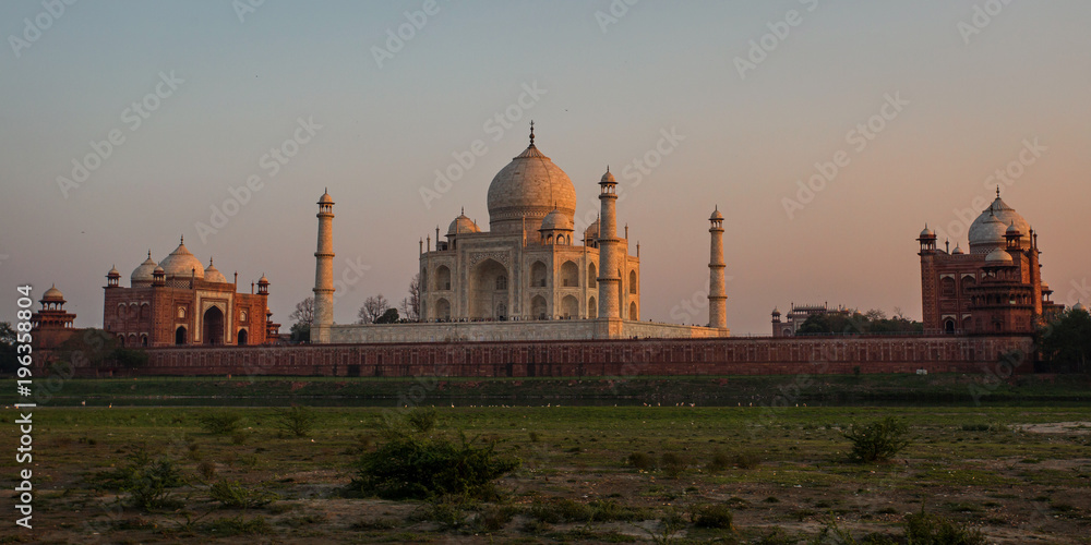 The backsite of the Taj Mahal at sundown in Agra in India