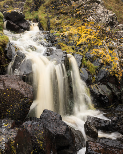 Fototapeta Naklejka Na Ścianę i Meble -  Waterfall surrounded by Lichen