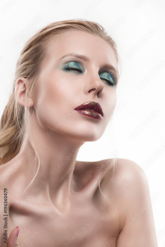 Portrait of beautiful young blond woman with clean face. High key shot. Portrait of beautiful young blond woman with clean face. High key shot.