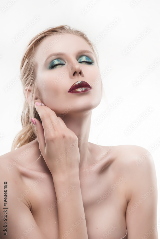 Portrait of beautiful young blond woman with clean face. High key shot. Portrait of beautiful young blond woman with clean face. High key shot.