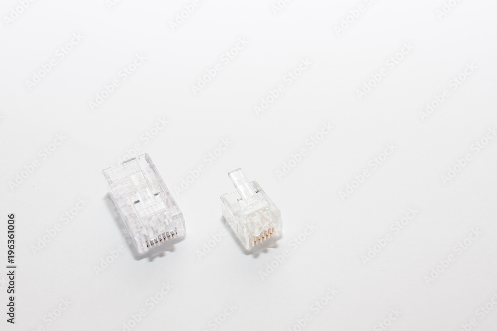 network cable with RJ45 connectors for conecting long distance communication closer on white background. network cable with RJ45 connectors for conecting long distance communication closer on white background.