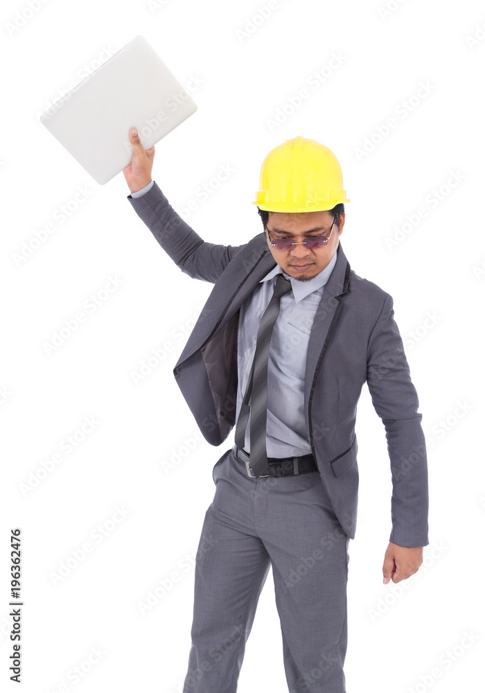 very angry engineer is throwing away his laptop isolated on white background very angry engineer is throwing away his laptop isolated on white background