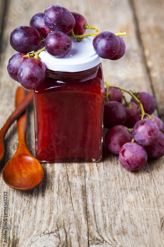 Jar of jam and grapes