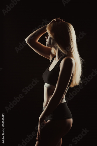 Silhouette of young pretty lady in black underwear the shadow © vpavlyuk