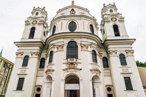 Universitatskirche church in University Square  Universitatsplatz  in Salzburg a rainy day