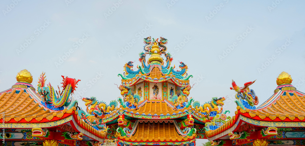 Chinese dragon is a symbol of power and wealthy in religious believe of Chinese people. In Chinese Taoism  monastery,  dragon is presented as powerful decoration on the roof, wall around the compound.
