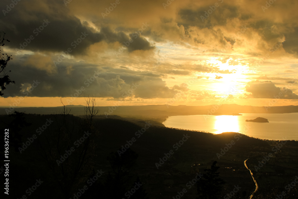 beautiful sunset, Panoramic view over the Lake of Bolsena, cloudy weather beautiful sunset, Panoramic view over the Lake of Bolsena, cloudy weather