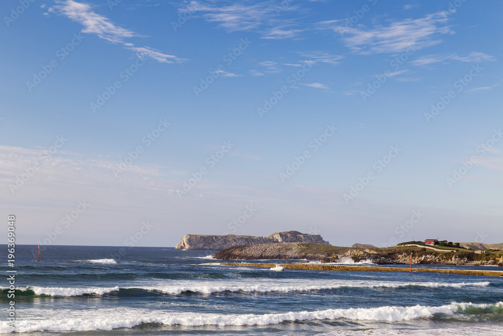 beautiful and rocky coastline under a blue sky for holidays


