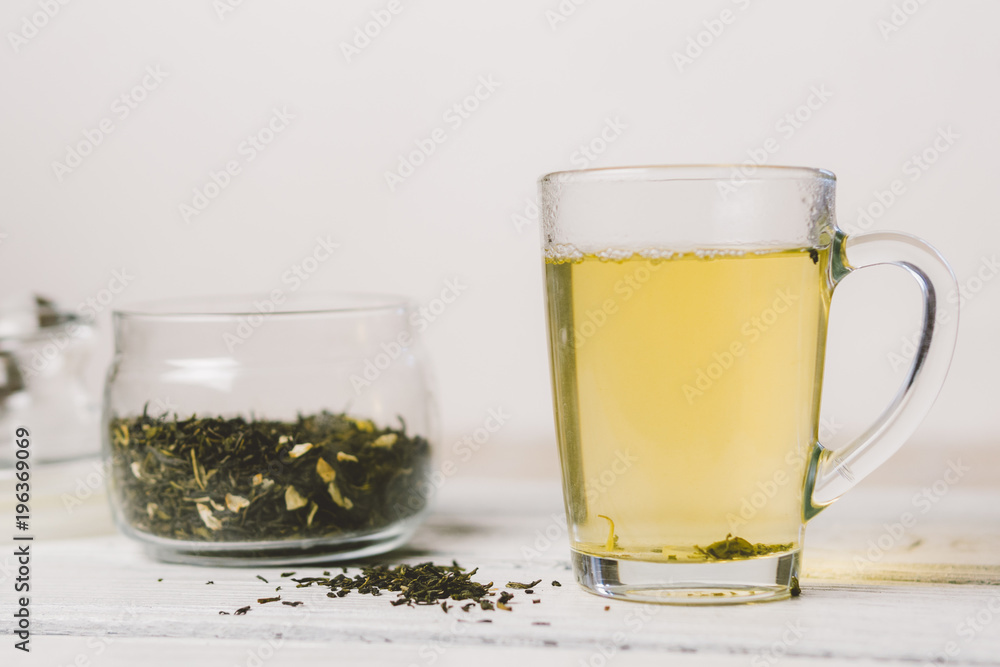Mug of green tea and dry tea Mug of green tea and dry tea