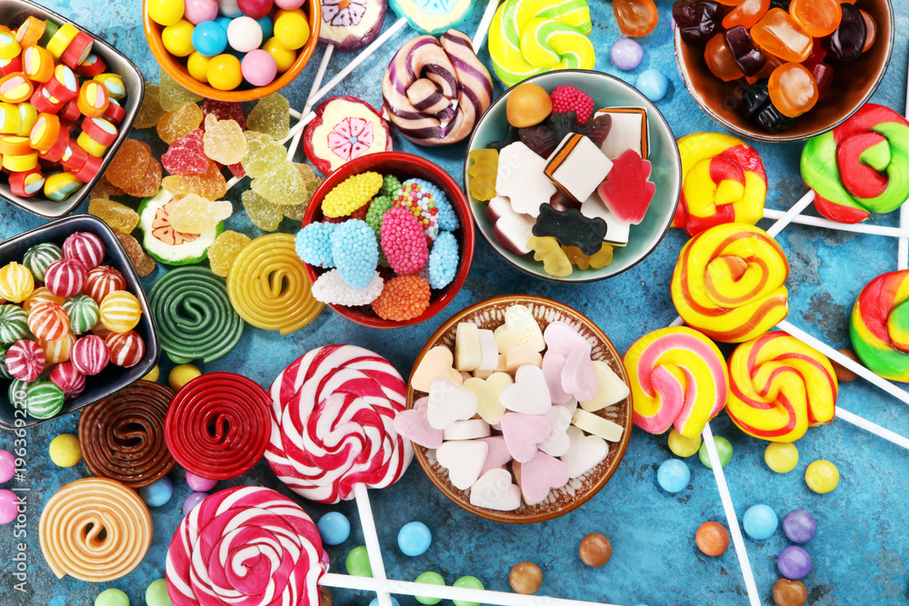 candies with jelly and sugar. colorful array of different childs sweets and treats. candies with jelly and sugar. colorful array of different childs sweets and treats.