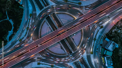 Expressway top view, Top view over the highway, expressway and motorway at night, Aerial view interchange of a city, Shot from drone, Expressway is an important infrastructure. photo