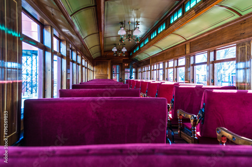Antique Passenger Car Interior with Red Louver Seats
