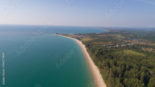 Aerial drone view of beautiful tropical island with sandy beach during sunny summer day