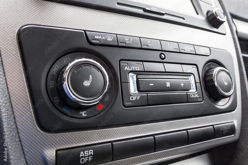 Driver hand tuning temperature control in car air conditioning system. Cooling the climate in vehicle interior Driver hand tuning temperature control in car air conditioning system. Cooling the climate in vehicle interior