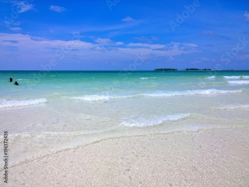 Ocean view of blue sky, beautiful clouds and pacific crystal turquoise water beside a tropical island with powdery white sand .  Cayo Guilermo , Cuba  © Krzysztof