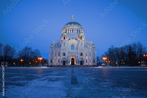 View of the Nikolsky Marine Cathedral on the Anchor Square in the March twilight. Kronstadt, Russia