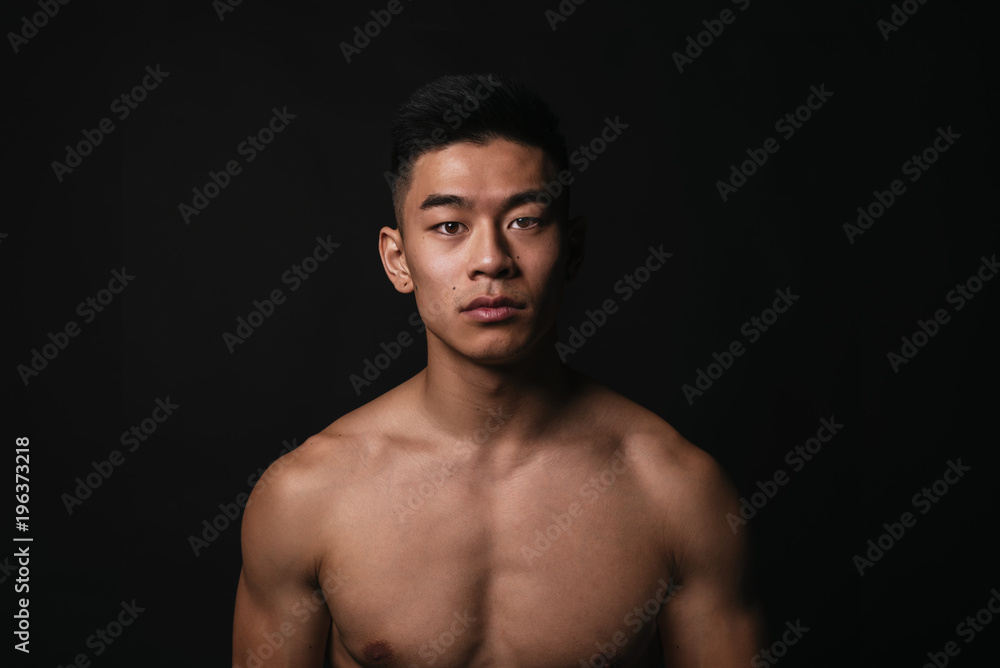 Portrait of young asian boy with fitness body.