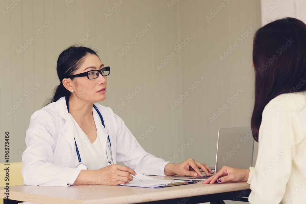 Female doctor checking patient health.According to the primary health insurance. medical health insurance concept Female doctor checking patient health.According to the primary health insurance. medical health insurance concept