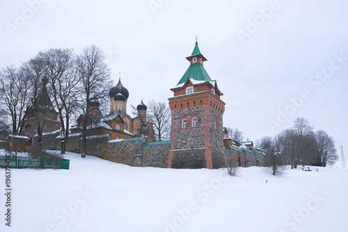 Overcast winter day at the walls of the Pyukhtitsky Assumption Monastery. Kuremae, Estonia