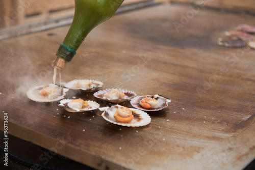 Queen scallops on the grill photo