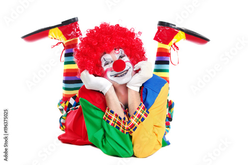 Happy clown  laying on the floor