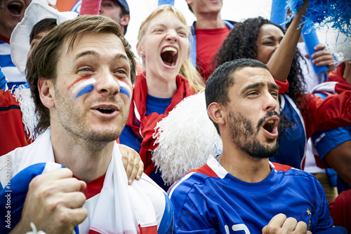 French football fans watching football match photo