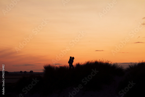 Silhouette of Woman Giving a Piggyback
