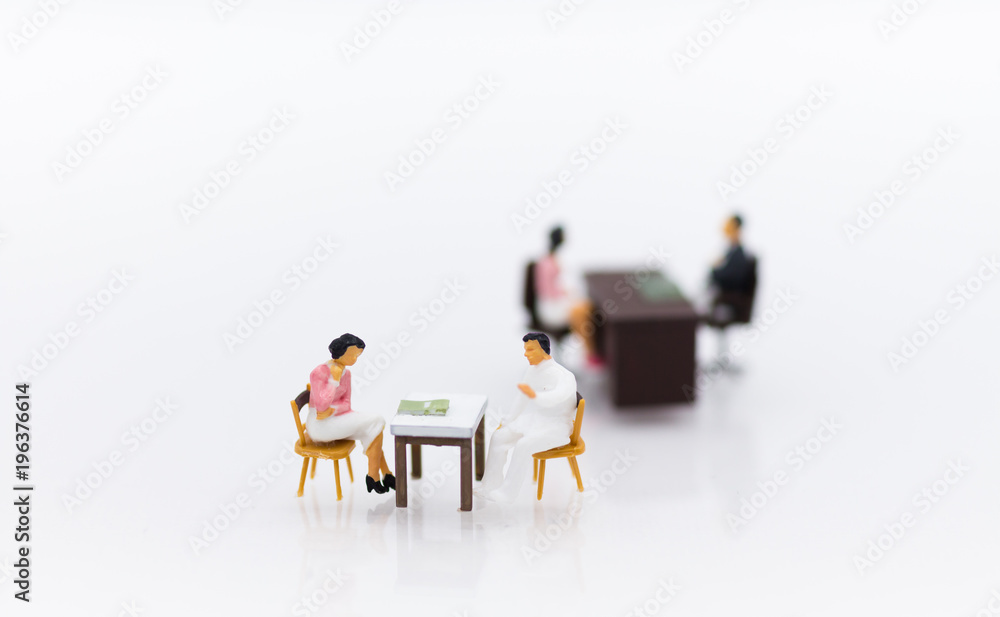 Miniature people : Businessman meeting with employee for job interviews, job vacancies. Image use for reducing unemployment rate. Miniature people : Businessman meeting with employee for job interviews, job vacancies. Image use for reducing unemployment rate.