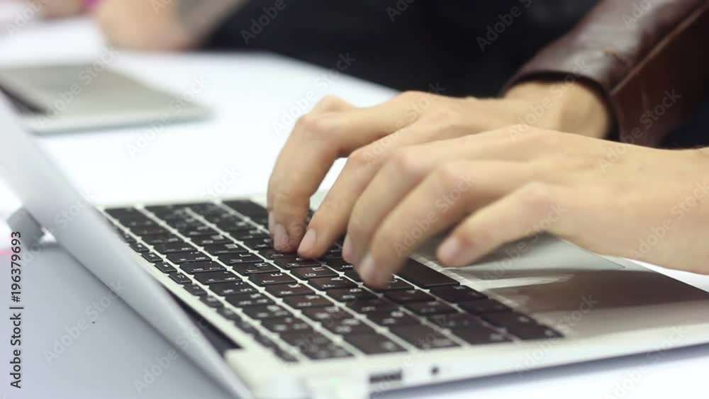 Business woman enjoys a tablet and a smartphone. Printing on a modern laptop at an exhibition of advanced technologies and innovations. Upgraded gadgets for young people. Business woman enjoys a tablet and a smartphone. Printing on a modern laptop at an exhibition of advanced technologies and innovations. Upgraded gadgets for young people.