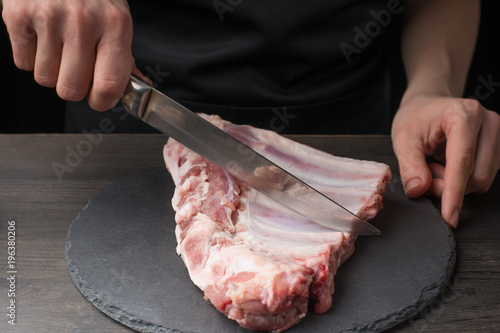 chef chef and raw pork ribs