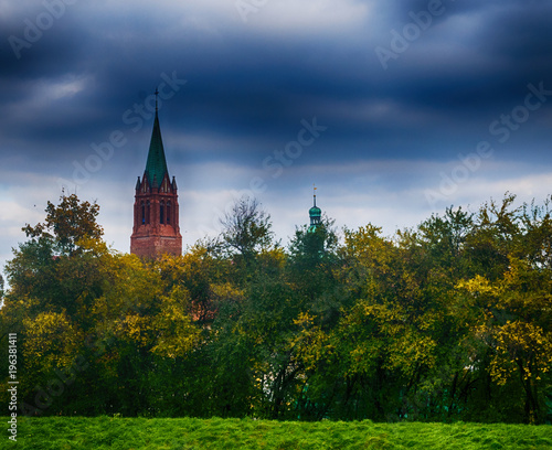 Cathedral in cloudy weather amid nature