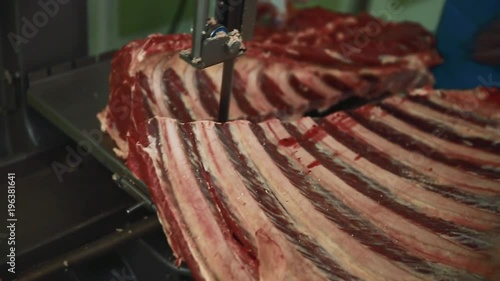 The butcher cut up the carcass. Close up.