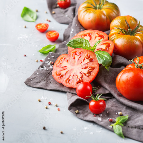 Assortment of ripe organic farmer red tomatoes on a table