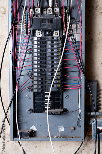Electrical service panel and branch circuit wiring in the basement of house under remodeling