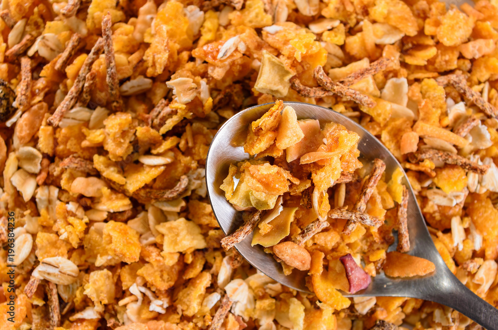Breakfast: Spoon with matinals cereals, flakes and grains, healthy food background. Breakfast: Spoon with matinals cereals, flakes and grains, healthy food background.