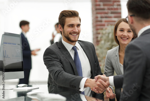happy man introducing businesswoman to business partners