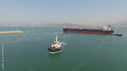 Aerial shot of a tug boat in the ocean in Manzanillo Mexico 