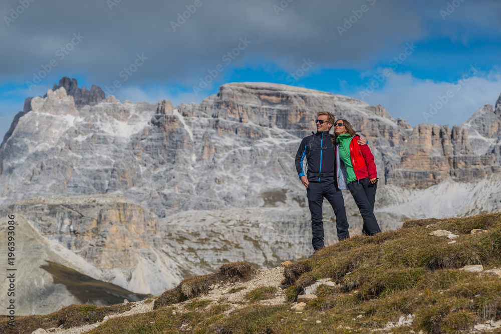 young couple in italien dolomites, mountain lovers and tourist, europien alps in summer