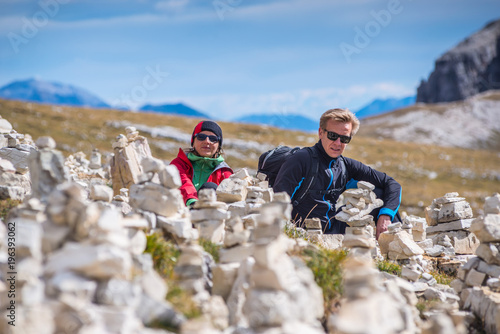 young couple in italien dolomites, mountain lovers and tourist, europien alps in summer photo