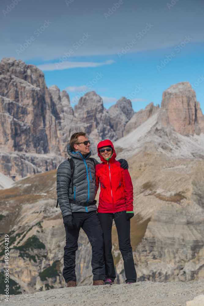 young couple in italien dolomites, mountain lovers and tourist, europien alps in summer