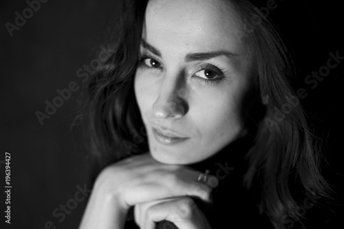 Black and white Portrait of beautiful young smiling tender woman. People concept.