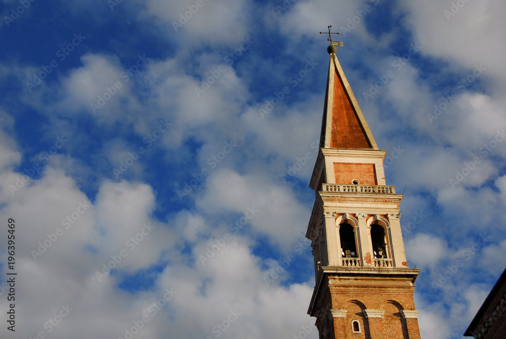 Saint Francis of the Vineyard Church renaissance bell tower among clouds in Venice, built in the 16th century by venetian architect Ongarin (with copy space)