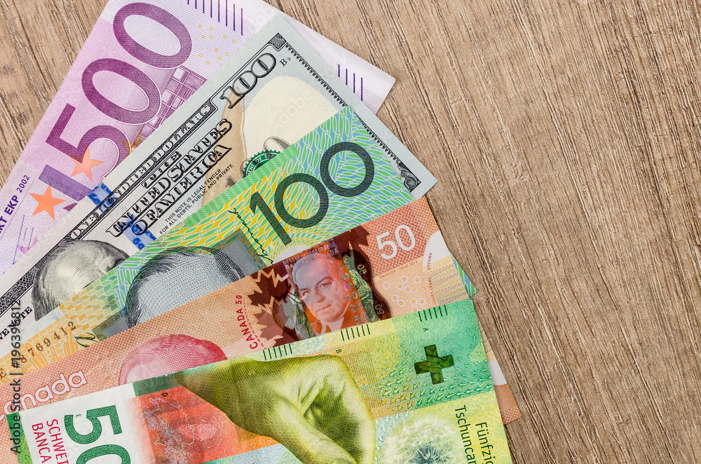 American dollars, European euro, Swiss franc, Canadian dollar, australian  dollar bills Stock Photo | Adobe Stock